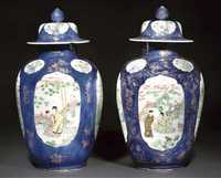 Kangxi A pair of famille verte powder blue ground jars and covers